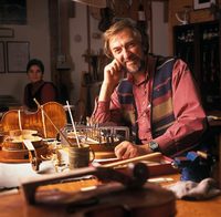 Luthiary Géza Burghardt and his wife in his Granville Island shop, where he creates<br/>and repairs wooden stringed instruments, from violins to guitars and acoustic bass