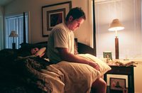 Brett Favre, star quarterback of the Green Bay Packers, wakes sore and tired after game day.