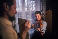 Father holds music for his daughter; Sovetskaya Gavan, Russia