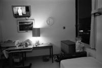 Alone in his hospital room near midnight before his risky surgery, Sergei<br/>stares out at the streets of Seattle, silent and withdrawn.