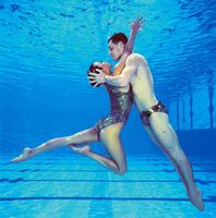 Synchronized swimming star Bill May, excluded from the Olympics because of his gender, practices with his partner, Kristina Lum