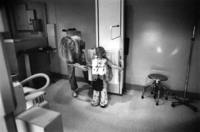 Sergei is carefully centered in the crosshairs of the X-ray camera. On this 5th day<br/>after surgery there was concern that he was developing pneumonia.