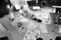 Sergei scans an assortment of get-well drawings sent to him<br/>from children in Mrs. Dinkles's class at Machias School.