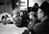 Translator Olga Strashnova comforts Sergei in his room at Seattle's Providence Hospital.