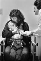 Foster mother Linda Johnson holds firm as Sergei cringes during a blood test.