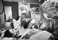  J.C. Gift, unable to talk because of a respirator tube in his throat,<br/>scrawls a message to his parents: "My chest hurts."