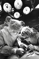 Surgeons graft skin over the grievous burns of J.C. Gift.