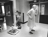Bridging the generation gap in the burn unit, Gerald Oderkirk, 63, takes 8-month old<br/>Kenny Hutto for a ride. The two were next-door neighbors in the ICU.